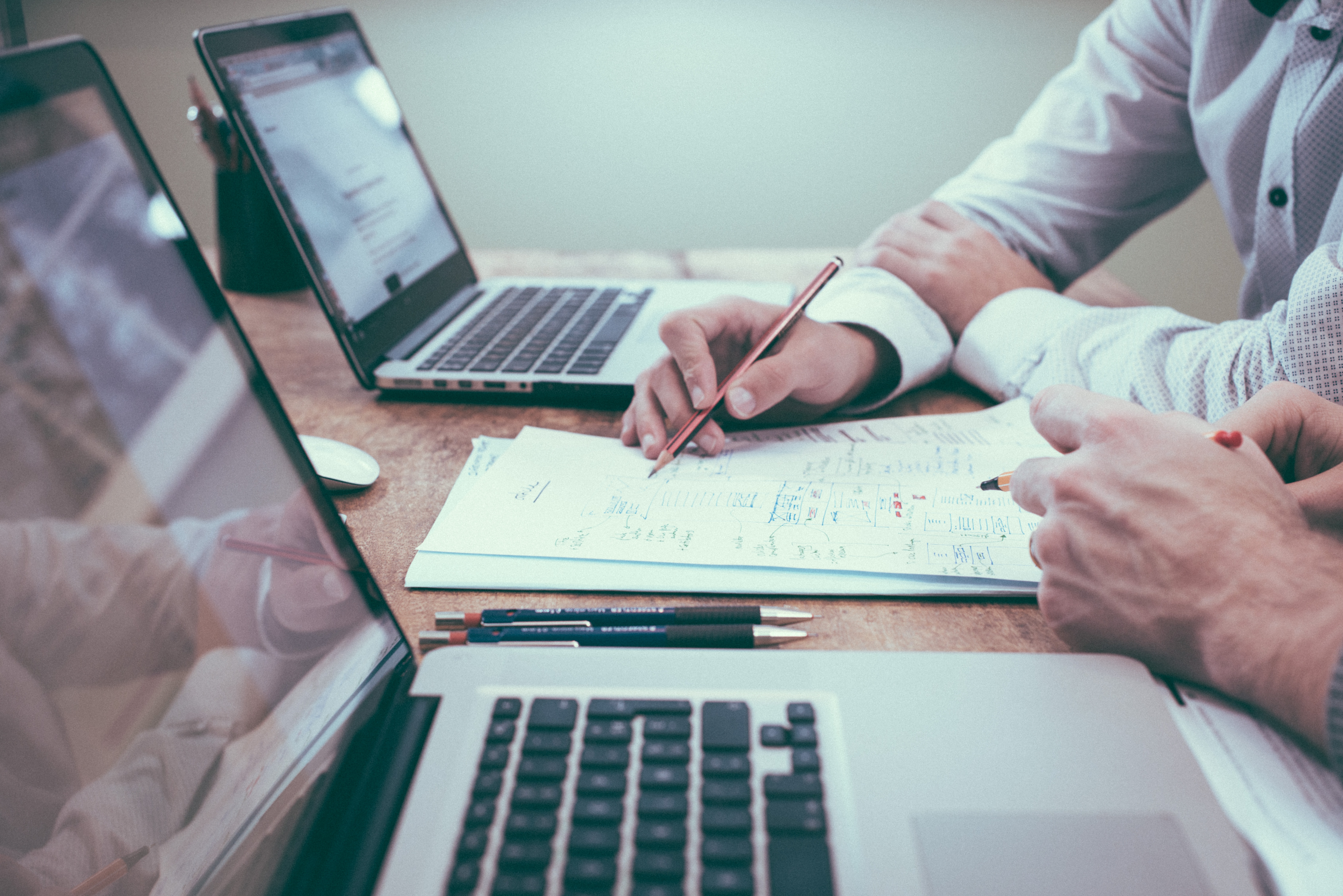 lawyers-using-laptops-and-notepad-to-review-a-case